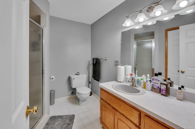 bathroom featuring tile patterned floors, vanity, walk in shower, and toilet