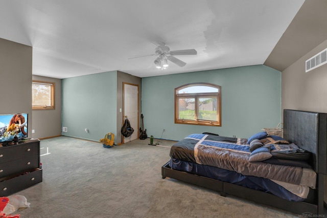 bedroom featuring ceiling fan, lofted ceiling, and carpet