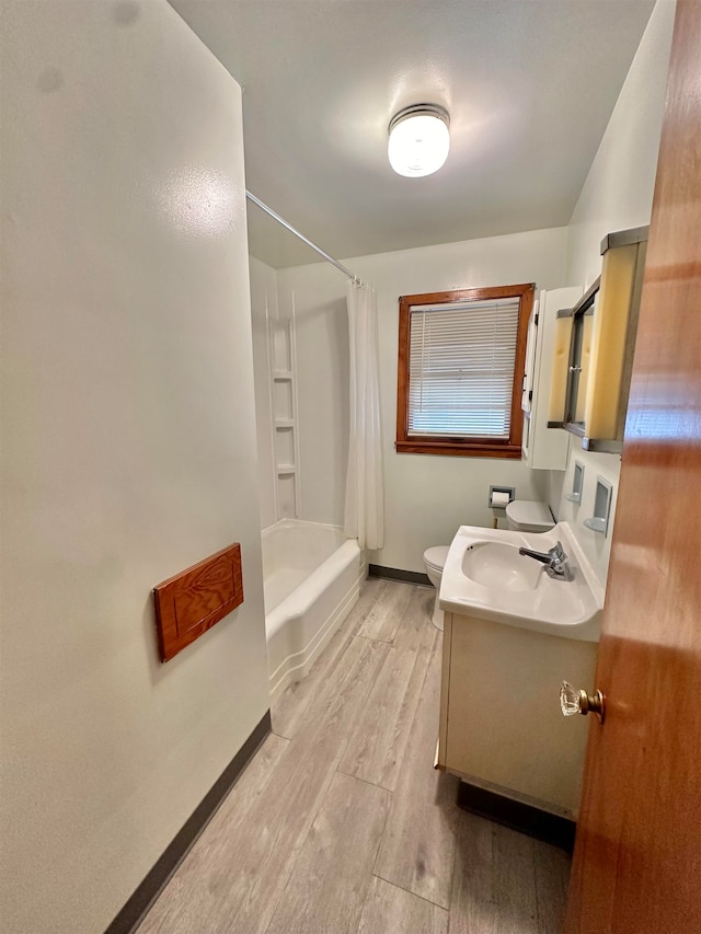 full bathroom with hardwood / wood-style flooring, shower / bath combination with curtain, vanity, and toilet