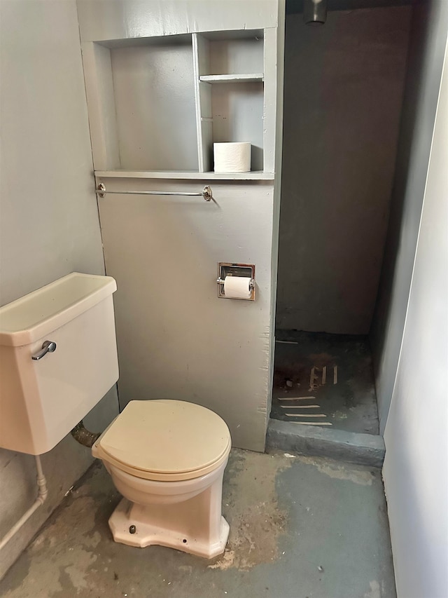 bathroom featuring toilet and concrete floors