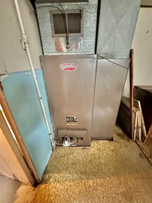 utility room with heating unit