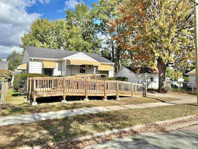 view of front of house with a wooden deck