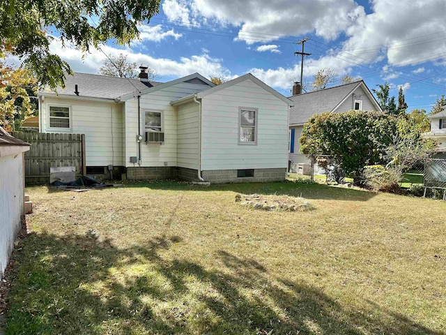 back of house featuring a yard