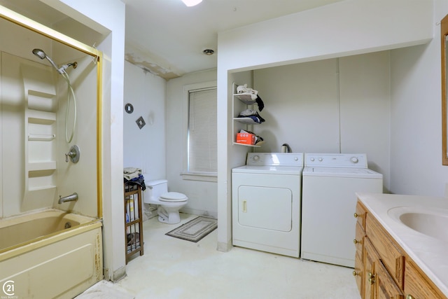 clothes washing area featuring washer and dryer