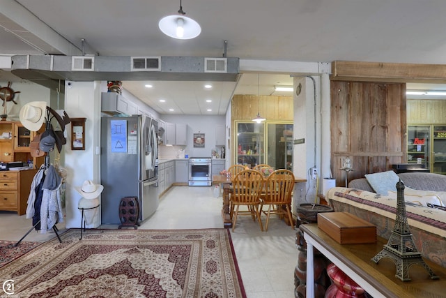 kitchen with pendant lighting and appliances with stainless steel finishes