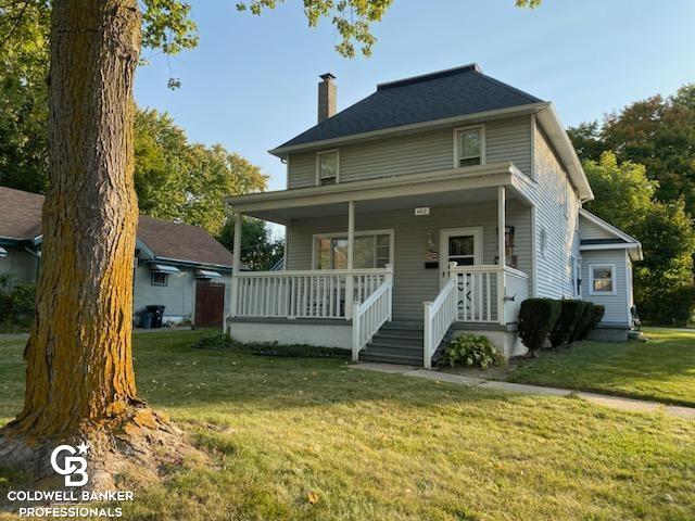 view of front of house with a front lawn and covered porch