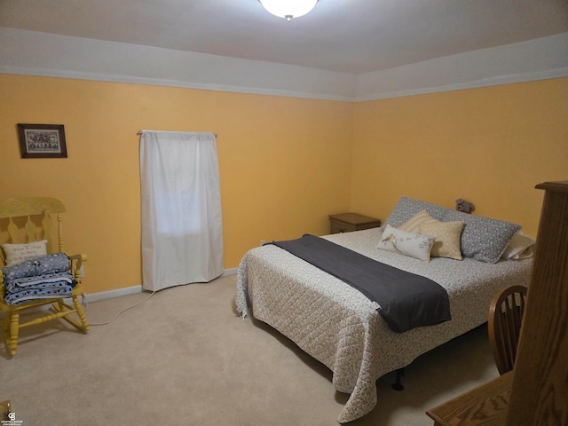 bedroom featuring light carpet