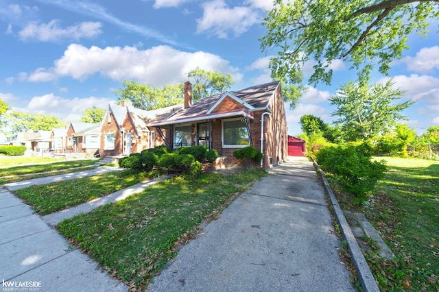 bungalow-style house featuring a front yard