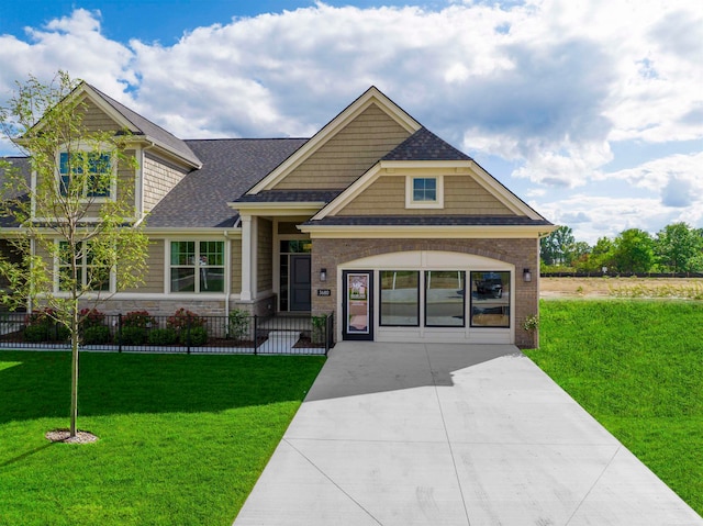 craftsman-style house with a front lawn