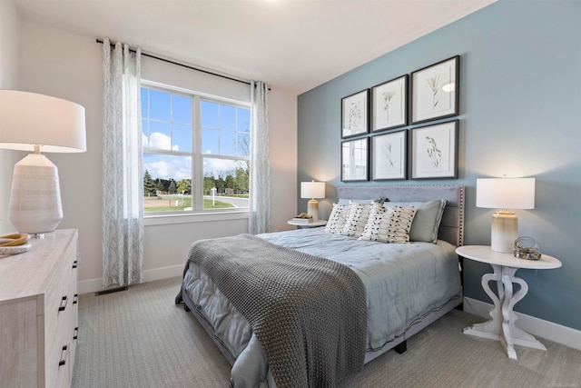 bedroom with light colored carpet