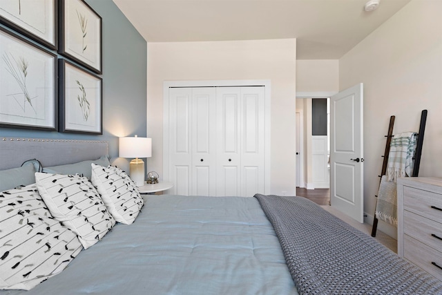 bedroom featuring hardwood / wood-style flooring and a closet