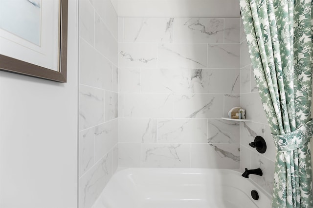 bathroom featuring shower / bath combo with shower curtain