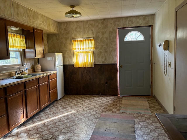 kitchen with white refrigerator and sink