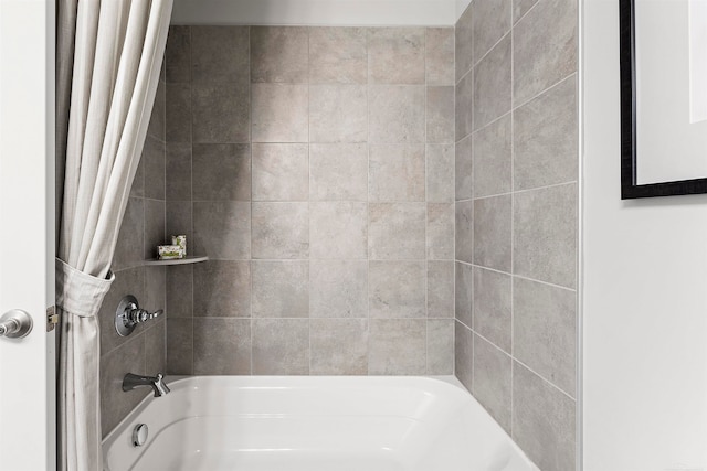 bathroom featuring shower / bathtub combination with curtain