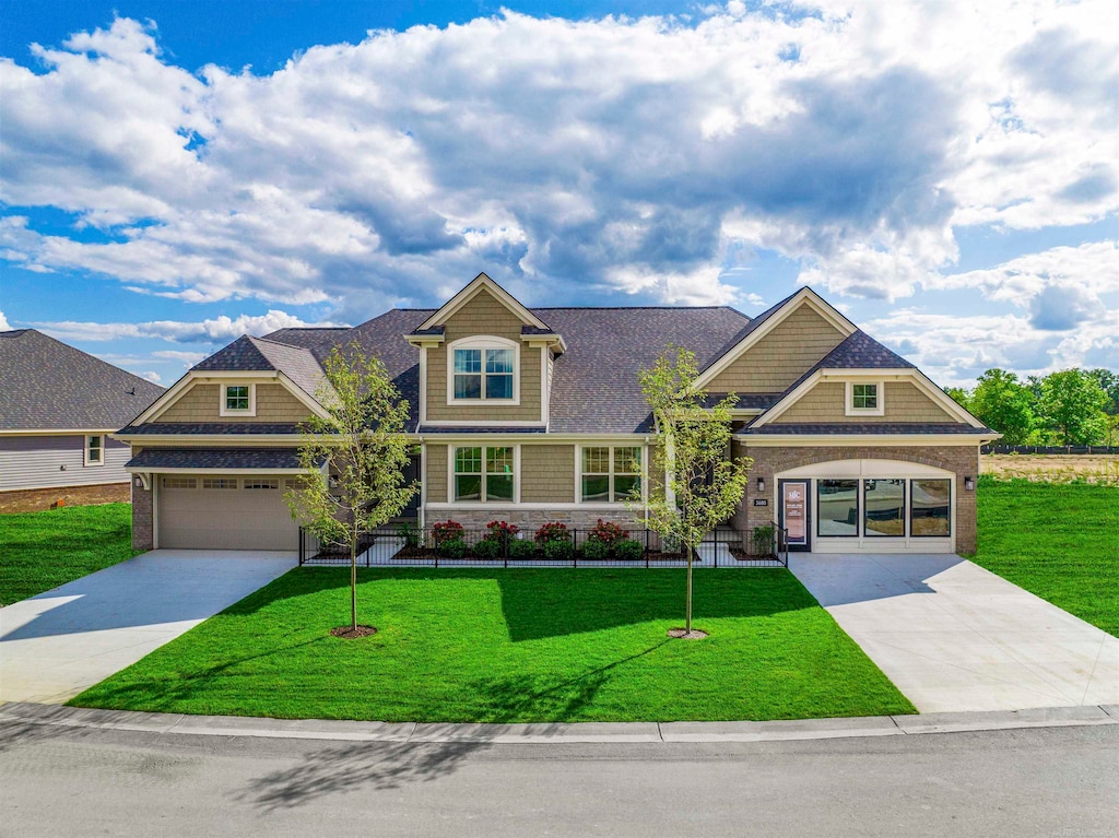 craftsman-style home featuring a front yard