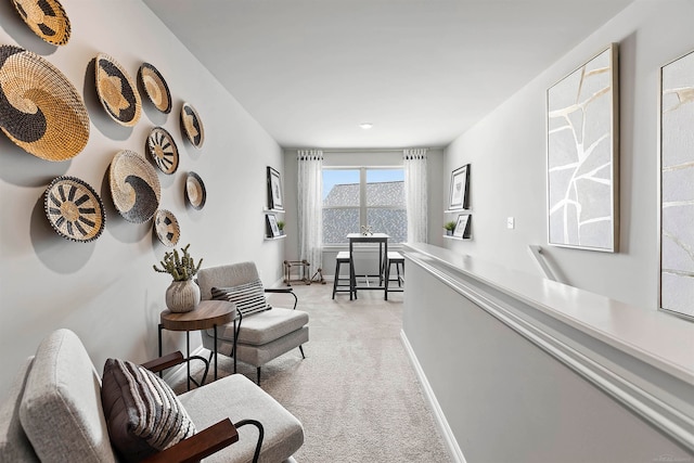 sitting room with light colored carpet