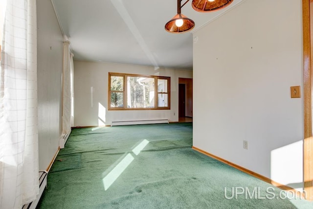 interior space featuring a baseboard heating unit, crown molding, and carpet