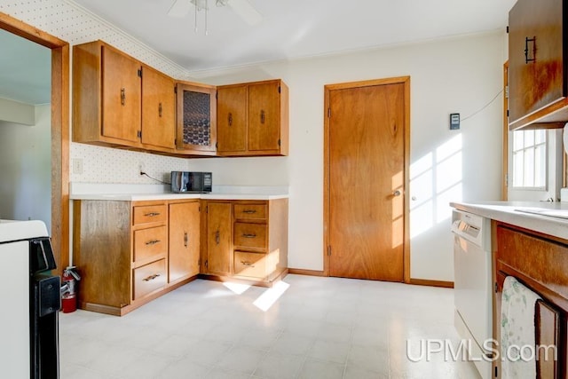 kitchen featuring ceiling fan, backsplash, and white dishwasher