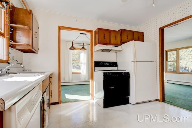 kitchen with white appliances, crown molding, baseboard heating, and sink