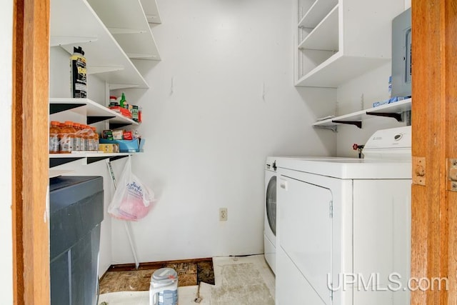 washroom with washing machine and dryer and electric panel