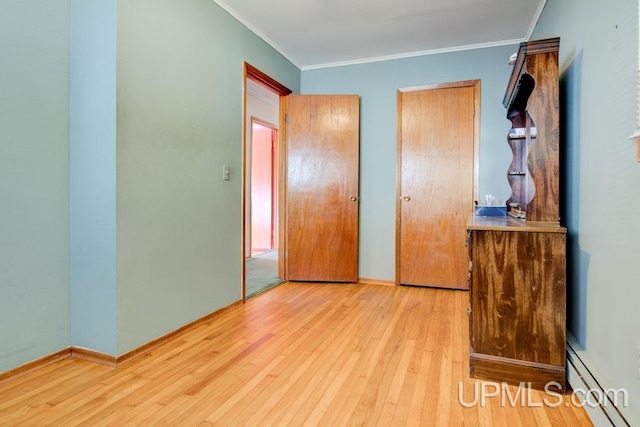 bedroom with ornamental molding, light hardwood / wood-style flooring, and baseboard heating