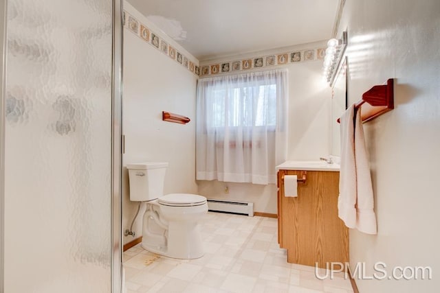 bathroom with vanity, baseboard heating, toilet, and an enclosed shower