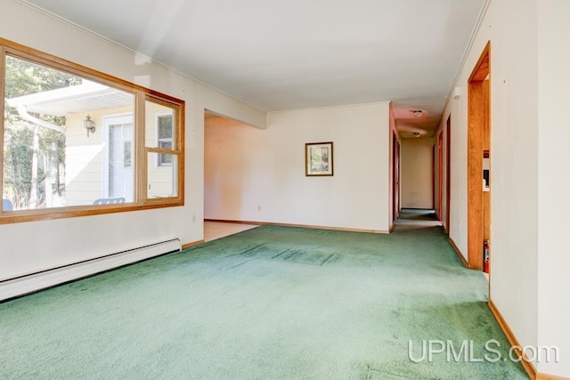 unfurnished room featuring ornamental molding, baseboard heating, and carpet flooring