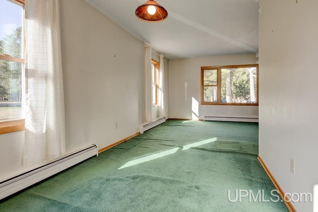 carpeted spare room with a baseboard radiator