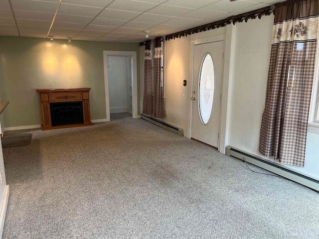 entryway featuring baseboard heating, carpet flooring, and track lighting