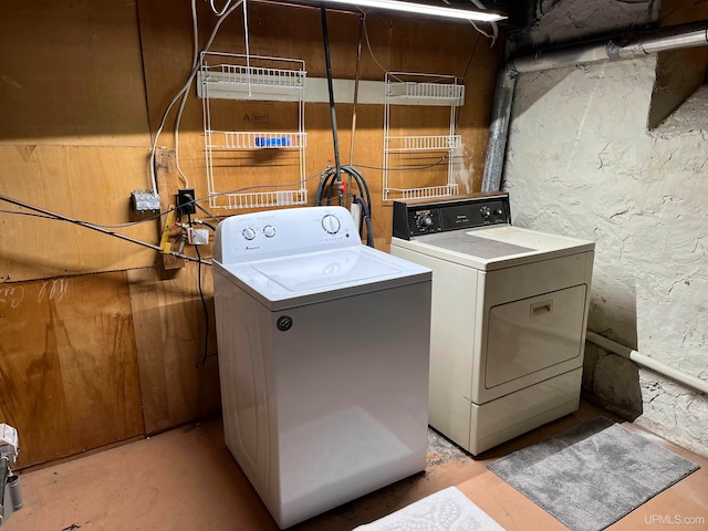 laundry room with washing machine and clothes dryer