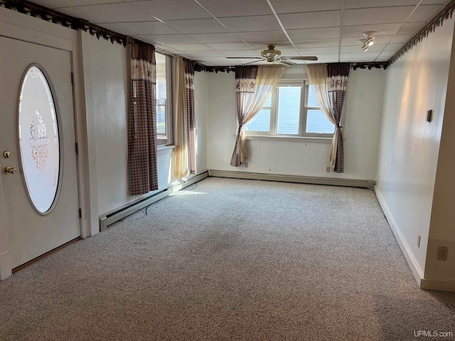 carpeted entryway with a paneled ceiling and ceiling fan