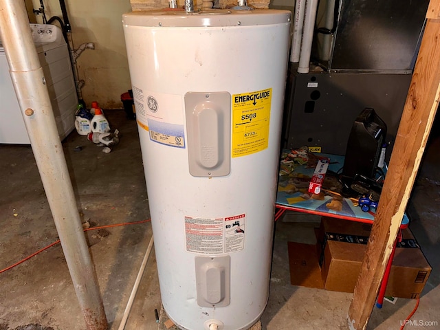 utility room featuring heating unit, washer / clothes dryer, and water heater