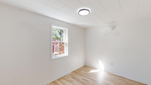 unfurnished room with light hardwood / wood-style floors