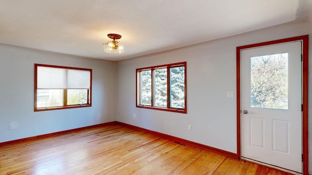 foyer entrance with light wood-type flooring