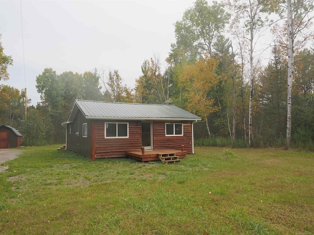 view of outdoor structure featuring a yard