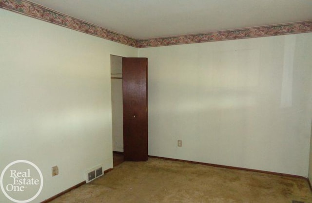 empty room featuring carpet flooring