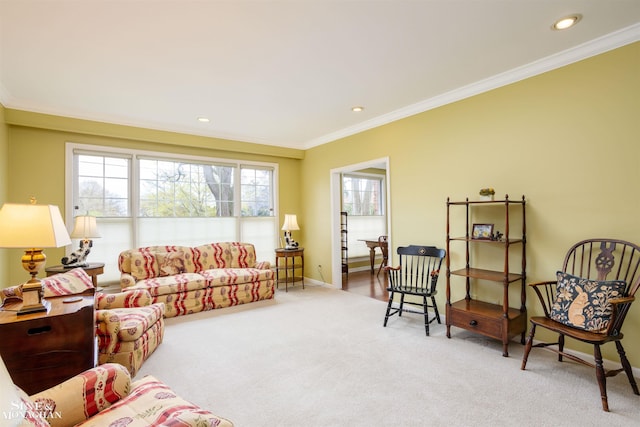 carpeted living room with ornamental molding and plenty of natural light