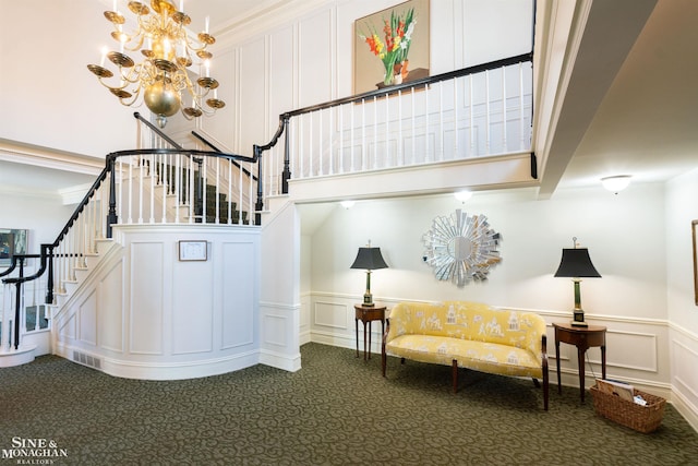 staircase featuring ornamental molding and carpet floors