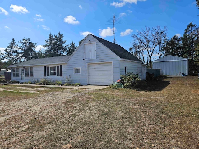 exterior space with a front lawn and a garage