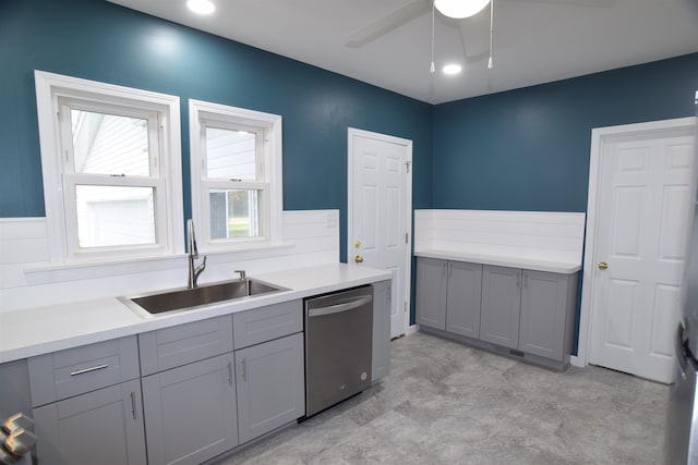 kitchen with gray cabinets, sink, and stainless steel dishwasher