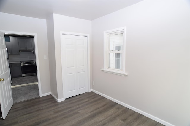 interior space with dark hardwood / wood-style flooring