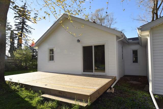 back of property with a wooden deck