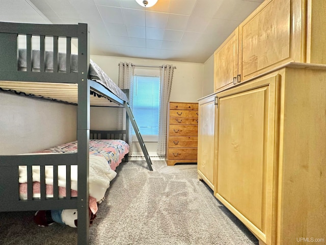 bedroom with light carpet