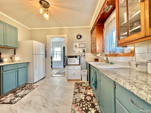 kitchen with ornamental molding, white appliances, light hardwood / wood-style flooring, and tasteful backsplash