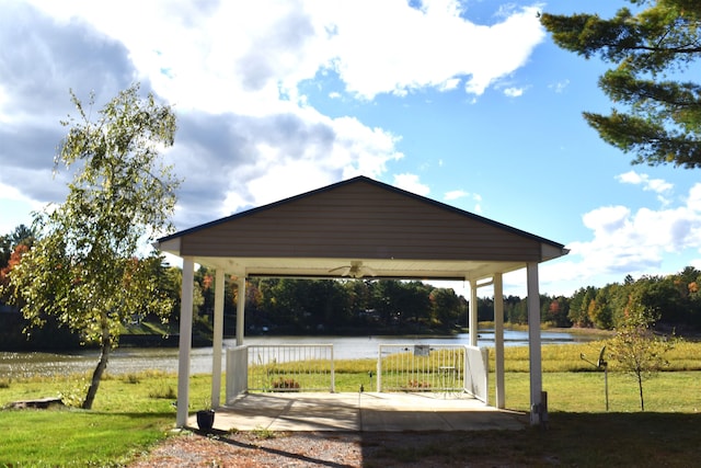 view of home's community featuring a yard and a water view