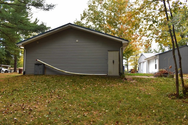 view of home's exterior with a yard