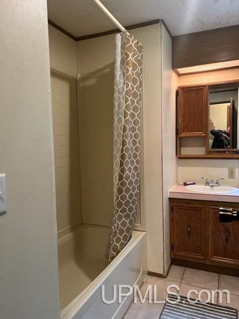 bathroom featuring vanity, shower / tub combo, and tile patterned flooring