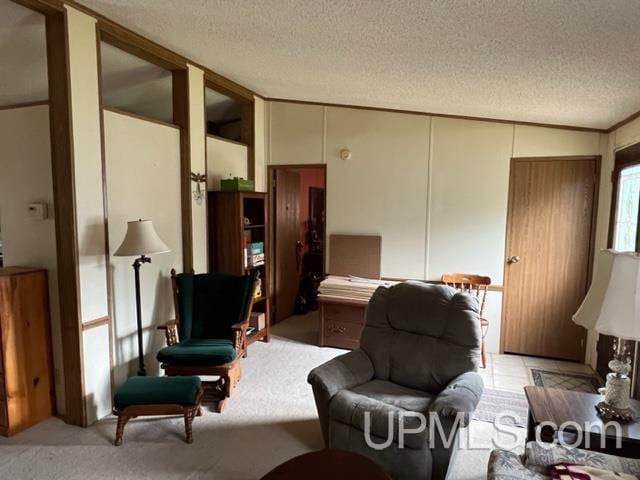 living area featuring light carpet, vaulted ceiling, and a textured ceiling