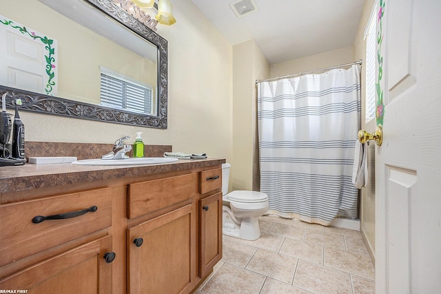 bathroom with vanity, toilet, tile patterned floors, and a shower with curtain