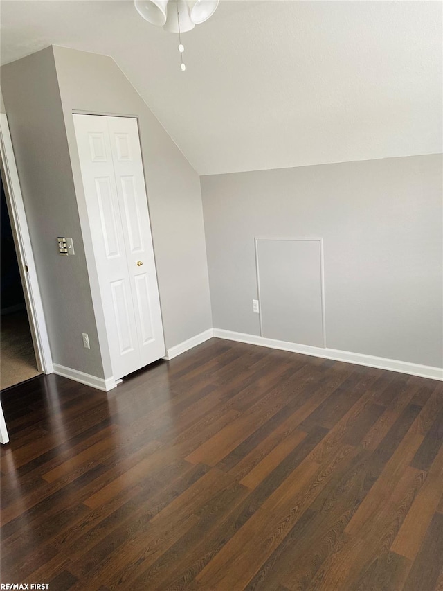 bonus room featuring ceiling fan, lofted ceiling, and dark hardwood / wood-style flooring